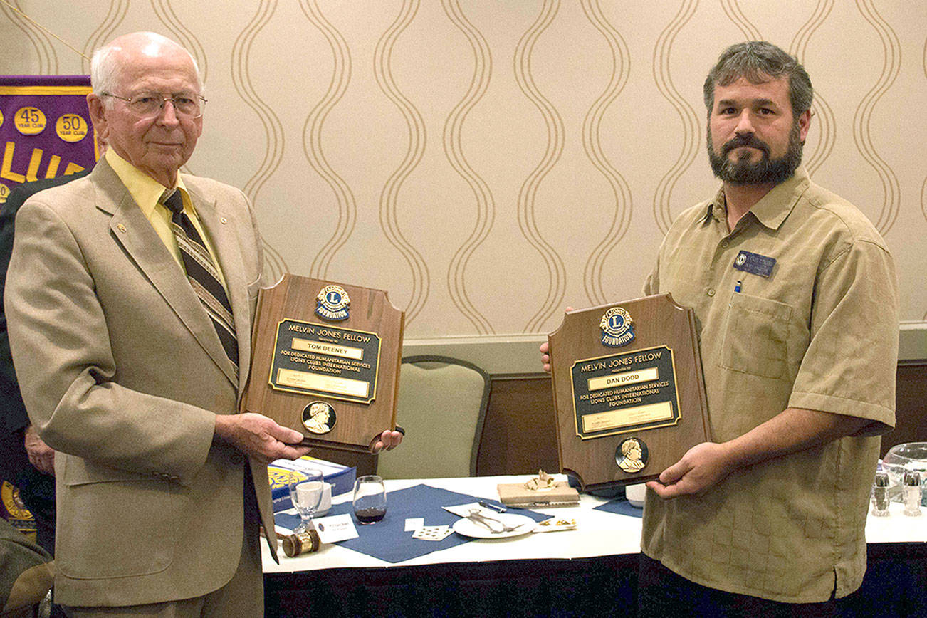 Port Angeles Lions Club members Tom Deeney, left, and Dan Dodd receive a Melvin Jones Fellowship Award. (Port Angeles Lions Club)