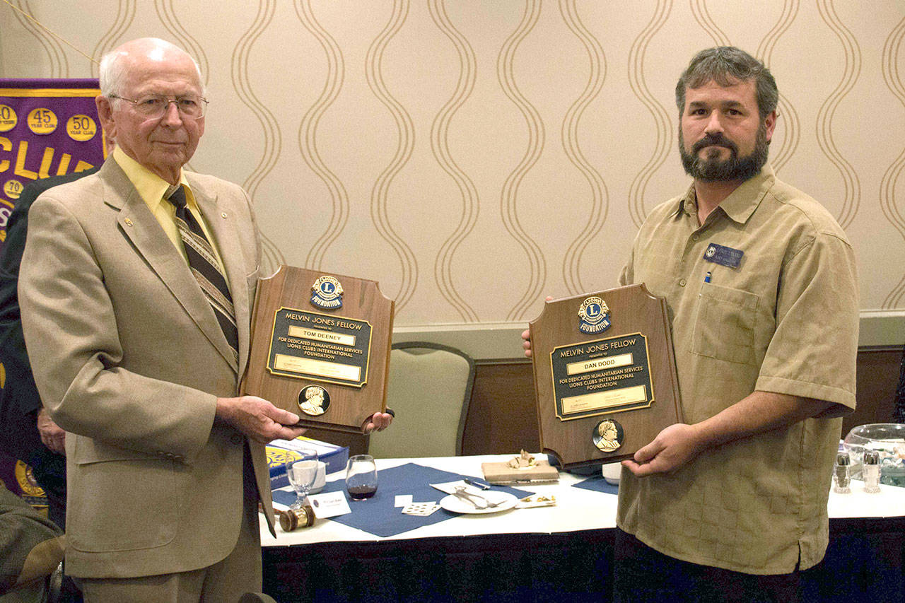 Port Angeles Lions Club members Tom Deeney, left, and Dan Dodd receive a Melvin Jones Fellowship Award. (Port Angeles Lions Club)