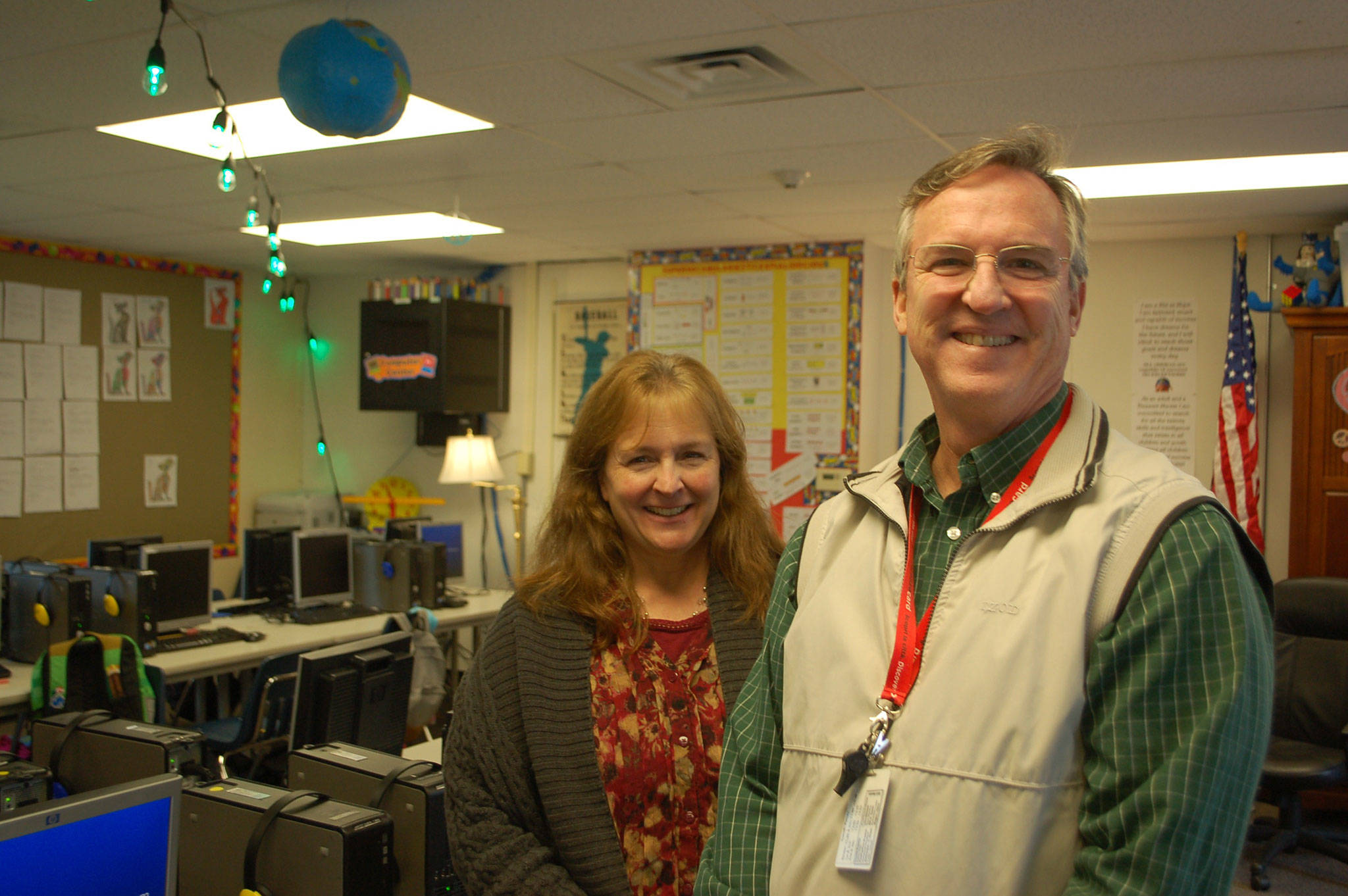 Melissa Withrow and Mark Knudson stand in what used to be the computer lab at Greywolf Elementary School that now serves as one of two new classrooms after more class sections were added at the first- and third-grade levels. (Erin Hawkins/Olympic Peninsula News Group)