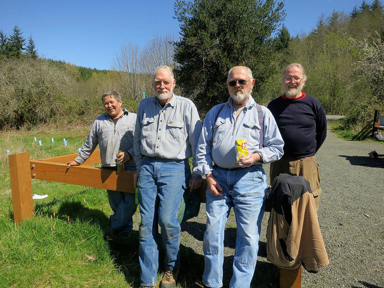The North Olympic Land Trust’s Stewardship Crew, pictured at the Pysht River Conservation Area, includes, from left, Steve Langley, Curt Batey, Cal Thomas and Elden Housinger. (Lorrie Mittman)