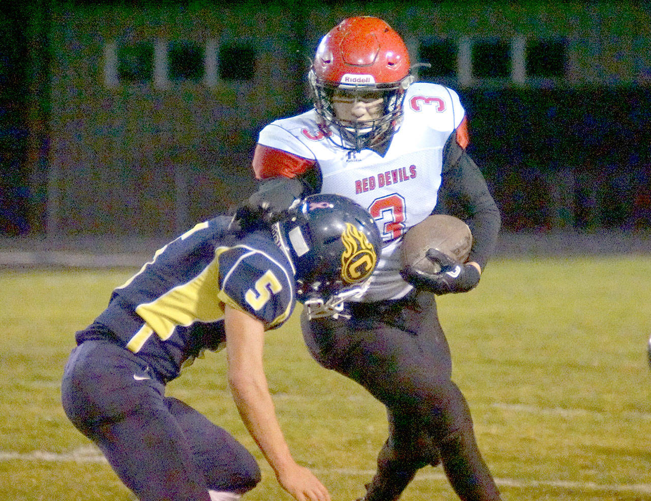 Neah Bay’s Isaiah Knaus runs against Naselle in the Red Devils’ Quad-District playoff loss. (By Robert Hilson/for Peninsula Daily News)