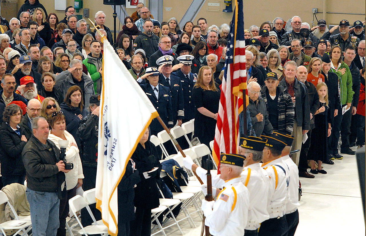 A color guard from American Legion Post 29 of Port Angeles presents the flags of the U.S. Coast Guard and of the United States at Saturday’s Veterans Day Ceremony at the U.S. Coast Guard Air Station/Sector Field Office Port Angeles on Ediz Hook. (Keith Thorpe/Peninsula Daily News)