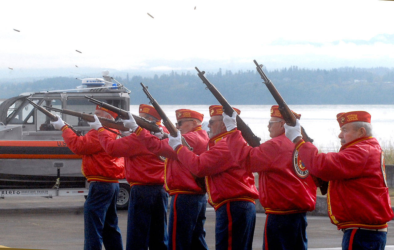 Members of the Mount Olympus Detachment 897 of the Marine Corps League deliver a three-volley rifle salute in honor of fallen veterans. (Keith Thorpe/Peninsula Daily News)