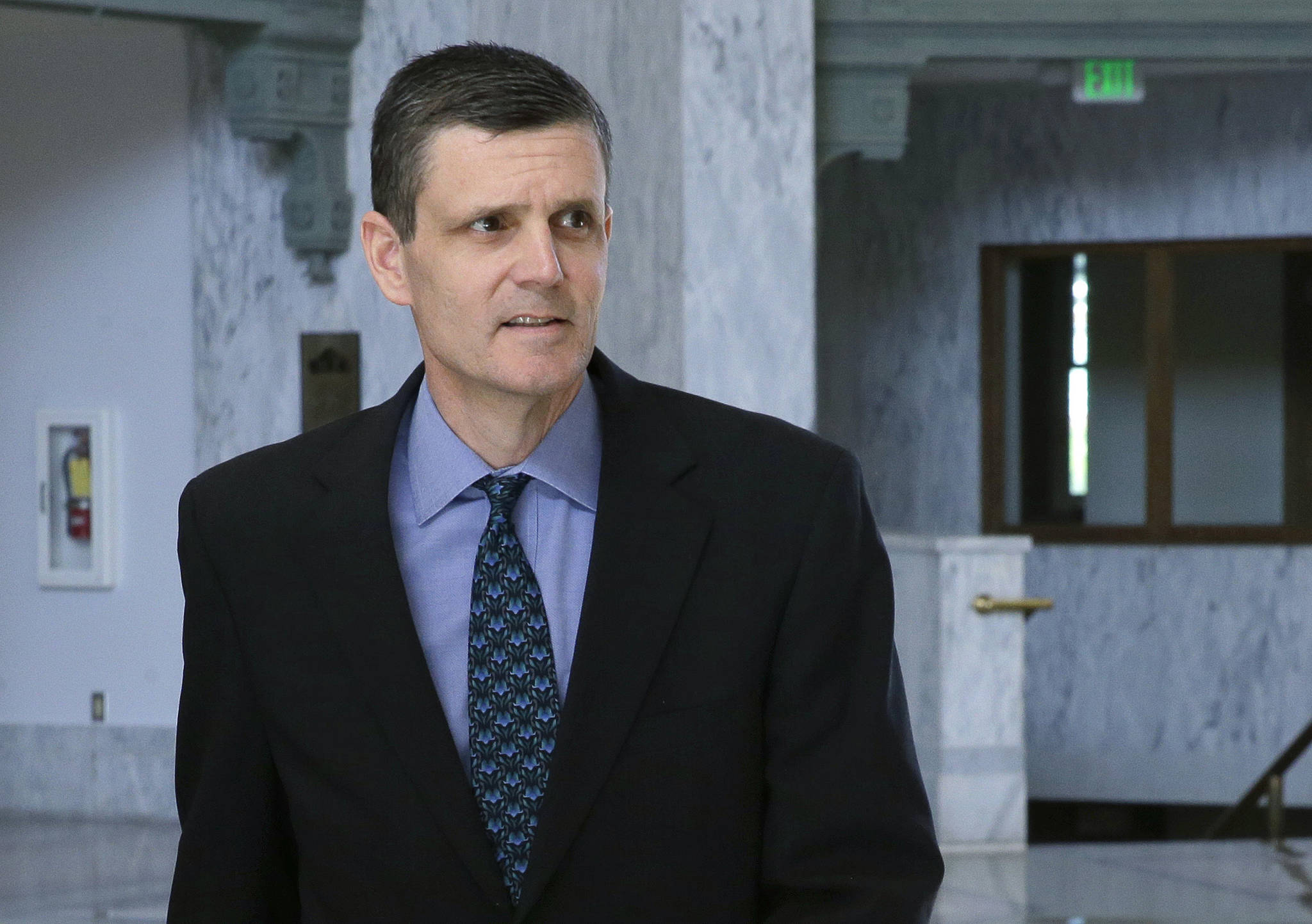 Washington State Auditor Troy Kelley leaves the federal courthouse in Tacoma on April 26, 2016. Kelley, whose federal fraud trial last year ended with an acquittal on one count and a deadlocked jury on more than a dozen others, will be in a courtroom once again this week as prosecutors try him a second time. And this time, newly recovered emails dating to 2003 could shed light on whether he was entitled to pocket the roughly $3 million the government says he stole when he ran a real-estate services business during the height of last decade’s housing boom. (Ted S. Warren/The Associated Press)