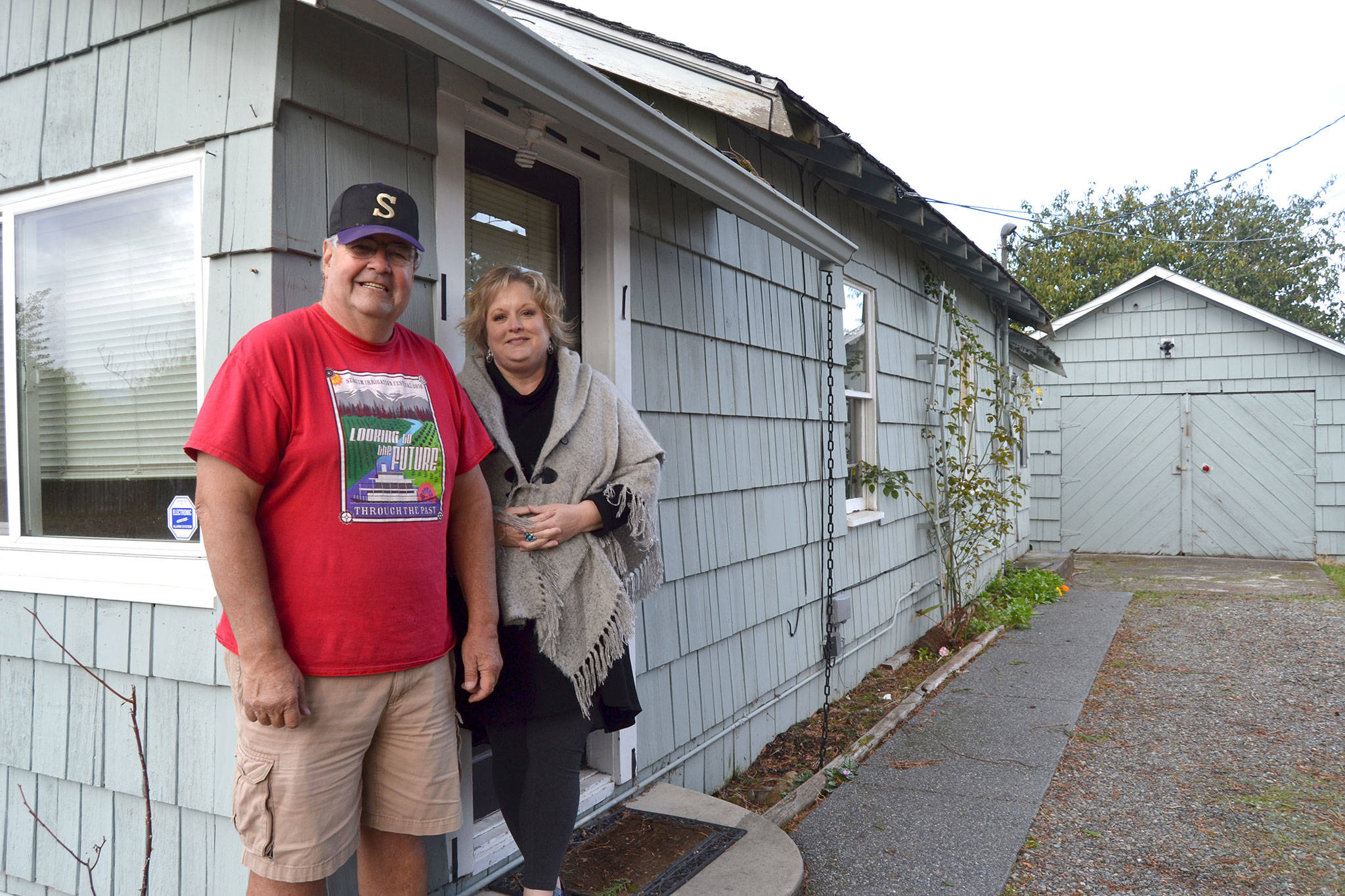 Stephen Rosales, board president for the Sequim Food Bank, and Andra Smith, executive director, stand at the new addition at 154 W. Alder St., next to the food bank at 144 W. Alder St. (Matthew Nash/Olympic Peninsula News Group)