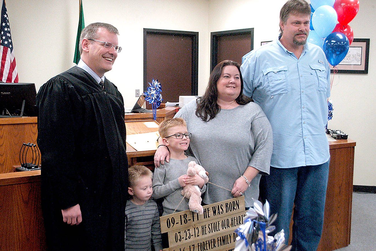 Four children celebrate adoption into forever families