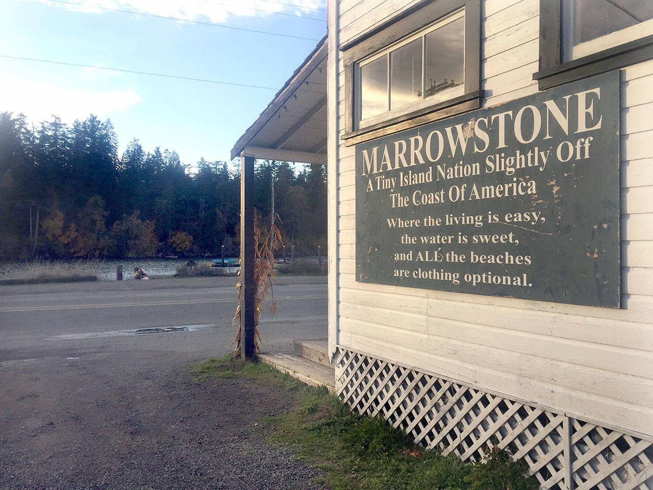 A sign on the side of the Nordland General Store tells visitors about Marrowstone Island, where plans for a marijuana production and processing facility have been denied by the Jefferson County hearing examiner. The owner of the Nordland General Store is not involved in the plans. (Cydney McFarland/Peninsula Daily News)
