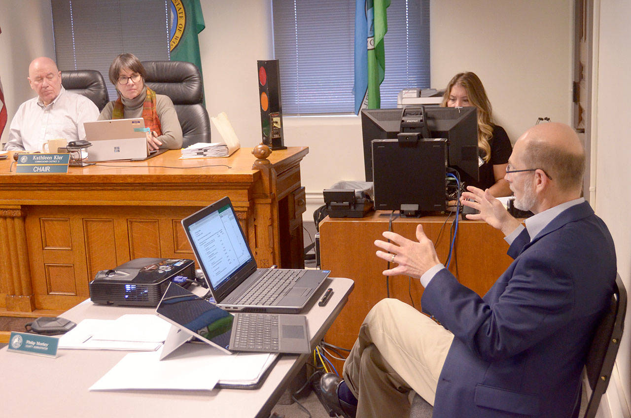 County Administrator Philip Morley gives a presentation to the Jefferson County Commissioners on the 2018 ad valorem taxes, for which the commissioners approved a 1 percent increase, during Monday’s meeting at the Jefferson County Courthouse. (Cydney McFarland/Peninsula Daily News)