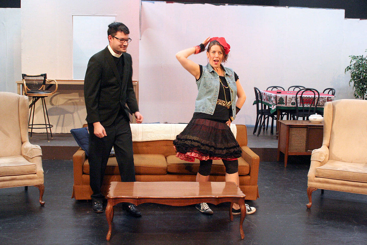 Kristin Ulsund strikes a pose alongside Jason Thompson of the Port Angeles Community Players during a rehearsal of “Making God Laugh.” (Kate Carter)