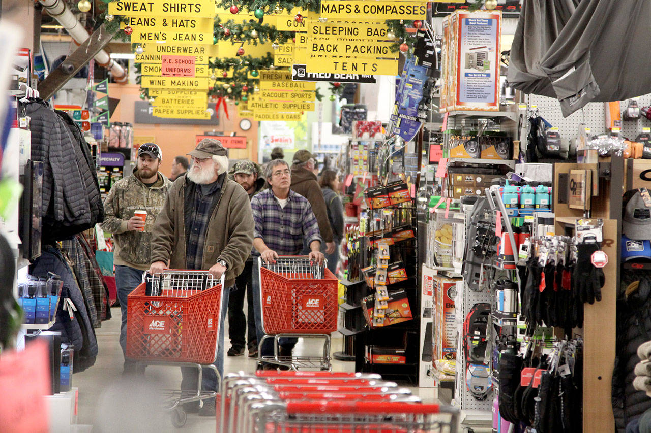 The aisles of Swain’s General Store in Port Angeles was crowded with many shoppers, mostly men, looking for that Black Friday bargain to start their holiday shopping. (Dave Logan/for Peninsula Daily News)