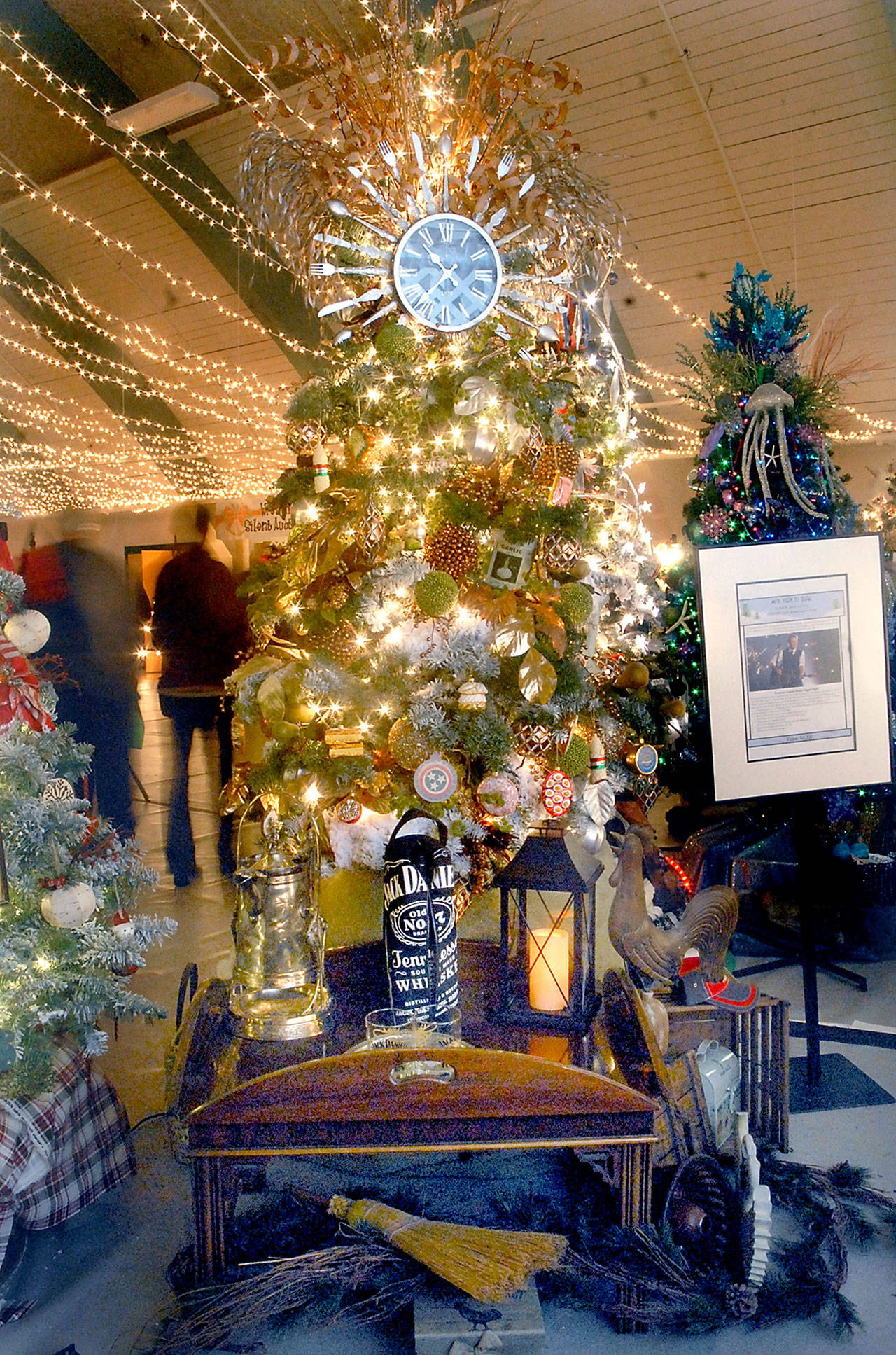 A Christmas tree titled “Farm to Table” stands on display at the 27th annual Festival of Trees at Vern Burton Community Center in Port Angeles. The tree, designed by Kathy Skinner and Pat Elmer and sponsored by Merrill & Ring, Inc., was the top auction tree fetching $6,500 for the Olympic Medical Center Foundation. Auction premiums included a trip to Nashville and tickets to the 2018 Country Music Awards. (Keith Thorpe/Peninsula Daily News)