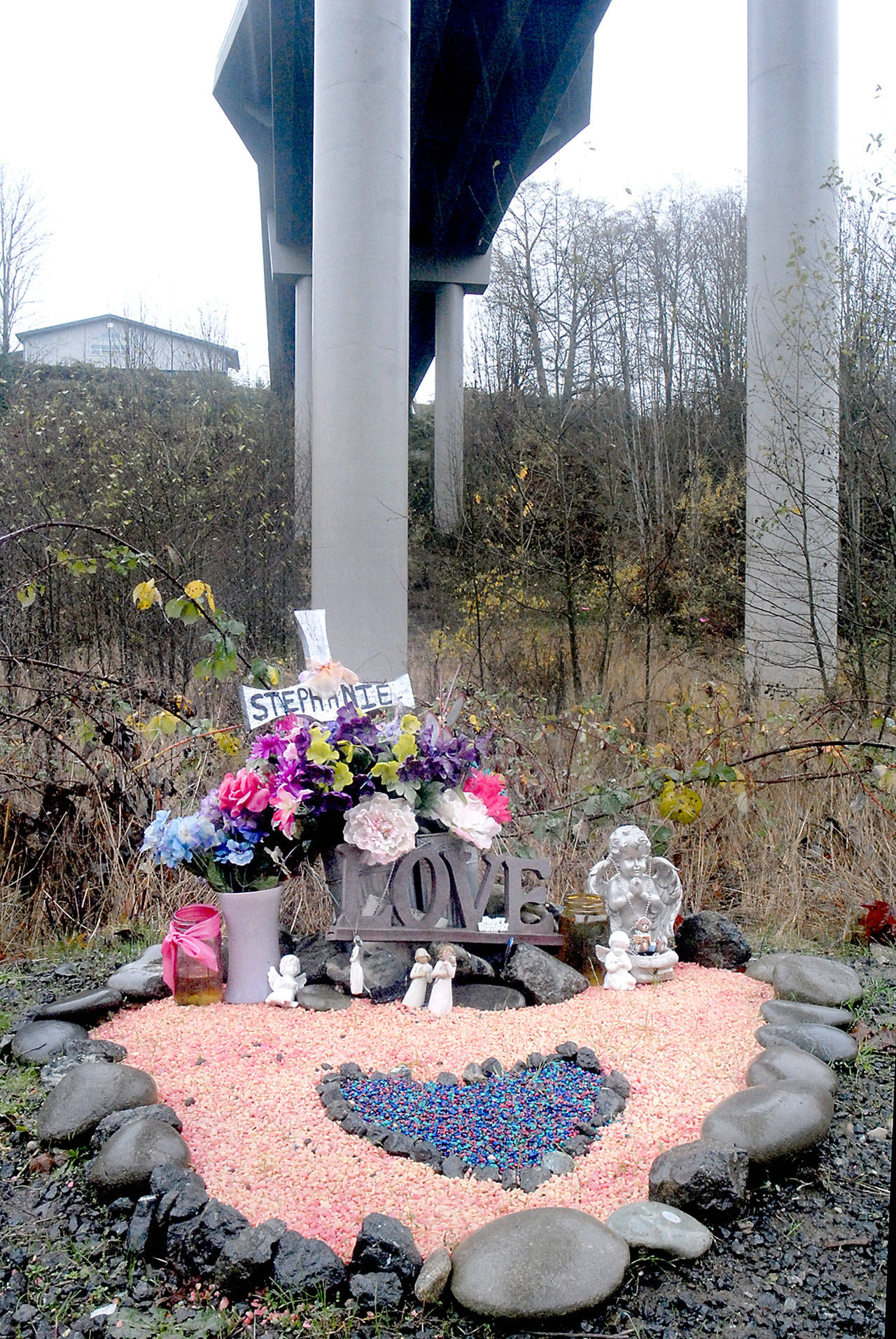 A memorial to Stephanie Diane Caldwell sits below the West Eighth Street bridge of Valley Creek. Caldwell, who was 21 at the time, jumped to her death at the spot Oct. 11, 2014. (Keith Thorpe/Peninsula Daily News)