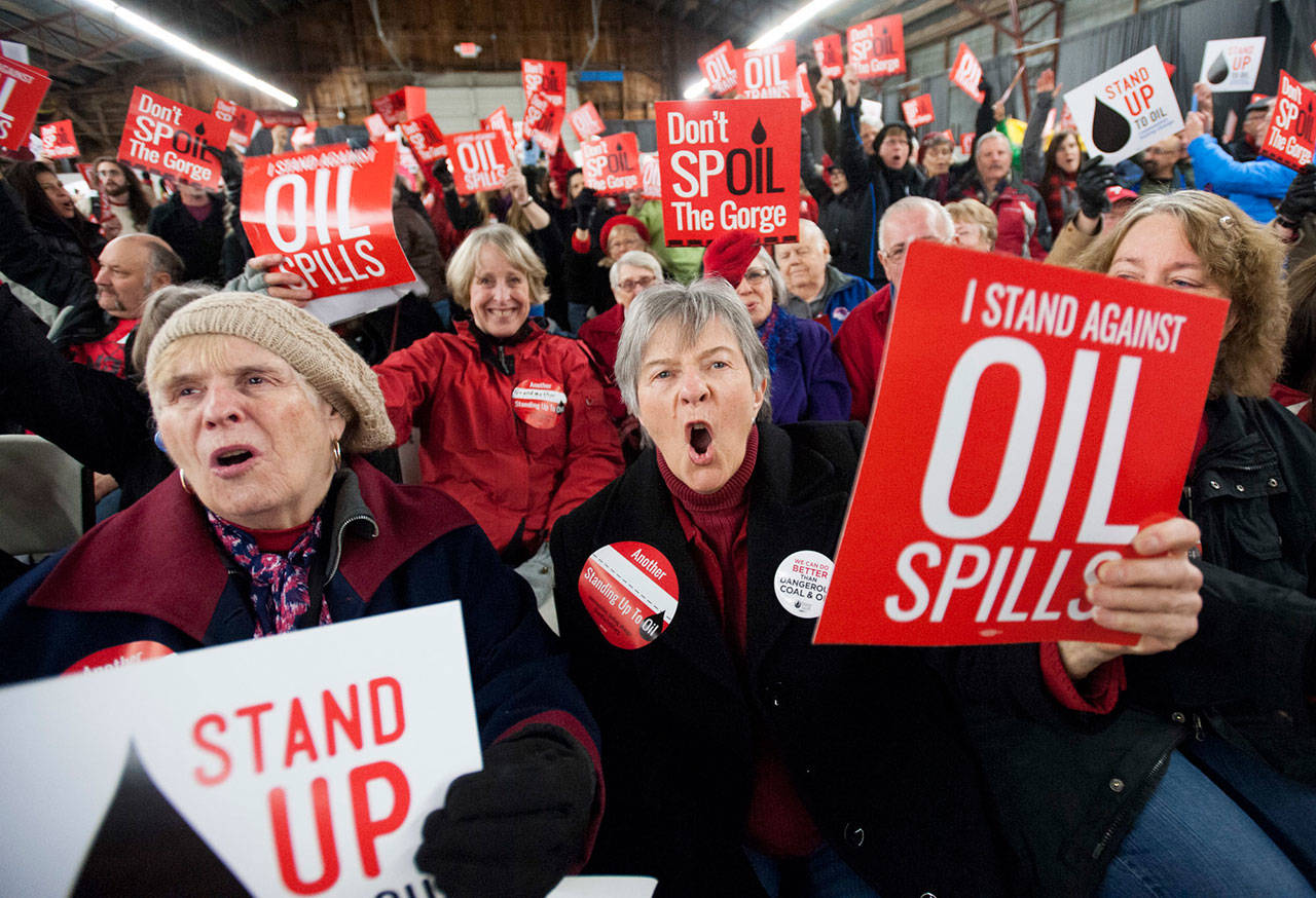 Maureen Hildreth, center, attends a public hearing on a proposed southwest Washington state massive oil-handling facility in Ridgefield in January 2016. (Natalie Behring/The Columbian via AP)