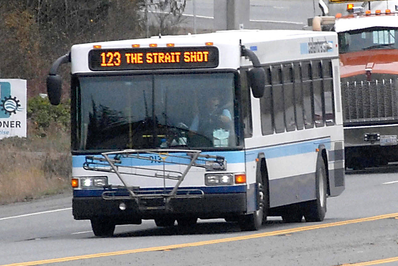Clallam Transit’s Strait Shot bus approaches Port Angeles on U.S. Highway 101 on a recent run from the Bainbridge Island ferry terminal. (Keith Thorpe/Peninsula Daily News)