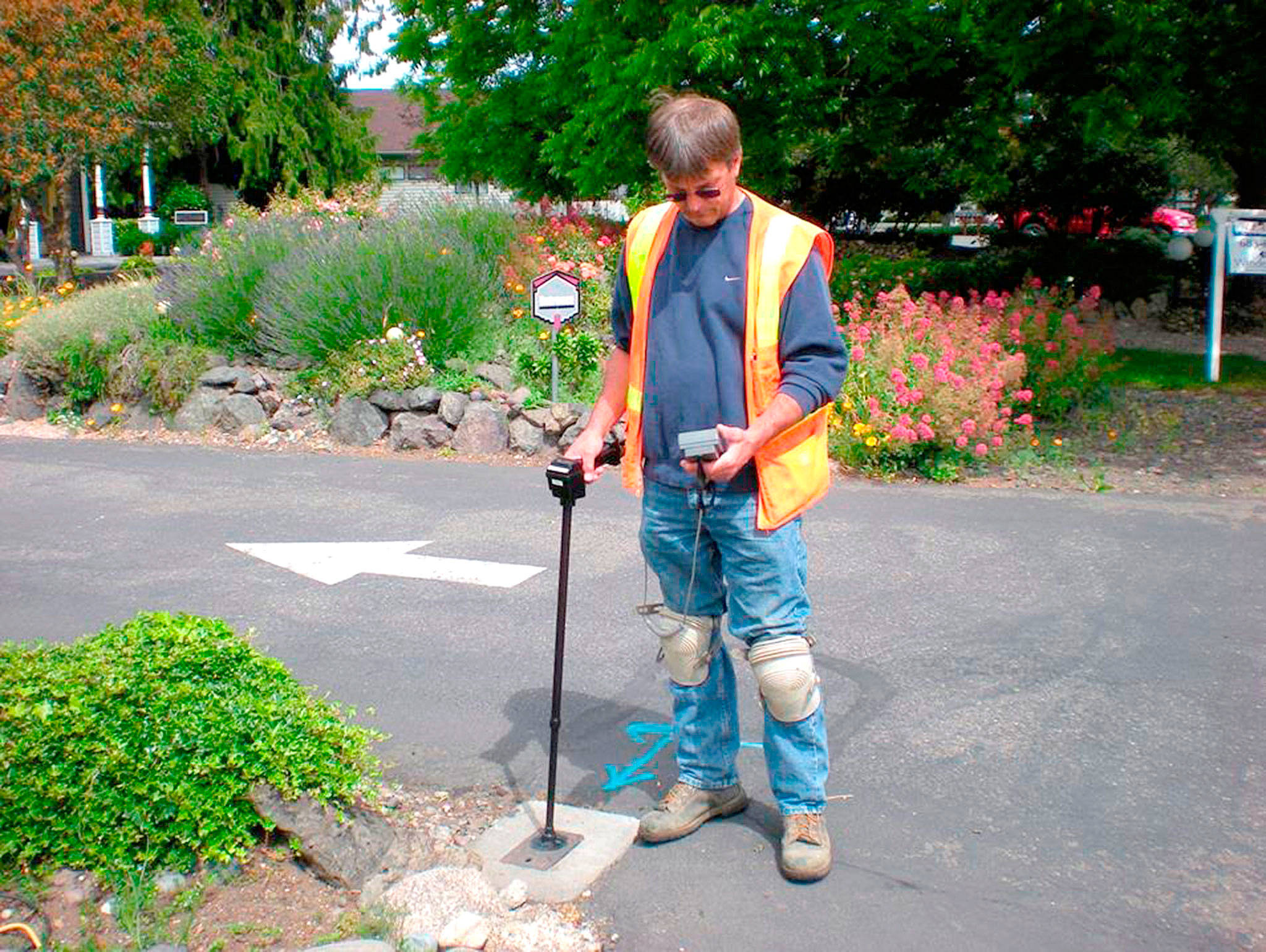 Kevin Hergert of the Sequim Public Works Department checks a meter at a local business. In 2018, qualifications for utility discounts are changing for low-income households. (Barbara Hanna/city of Sequim)