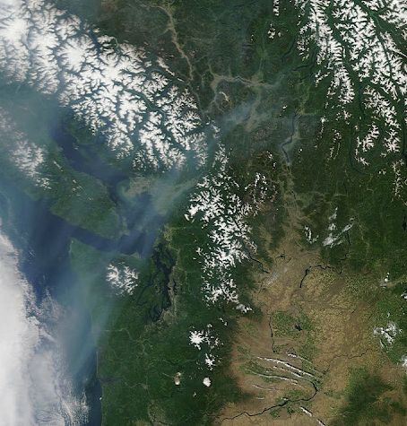 Satellite image clearly shows bands of smoke over the Olympic Peninsula that weather experts say come from wildfires in Asia. NASA