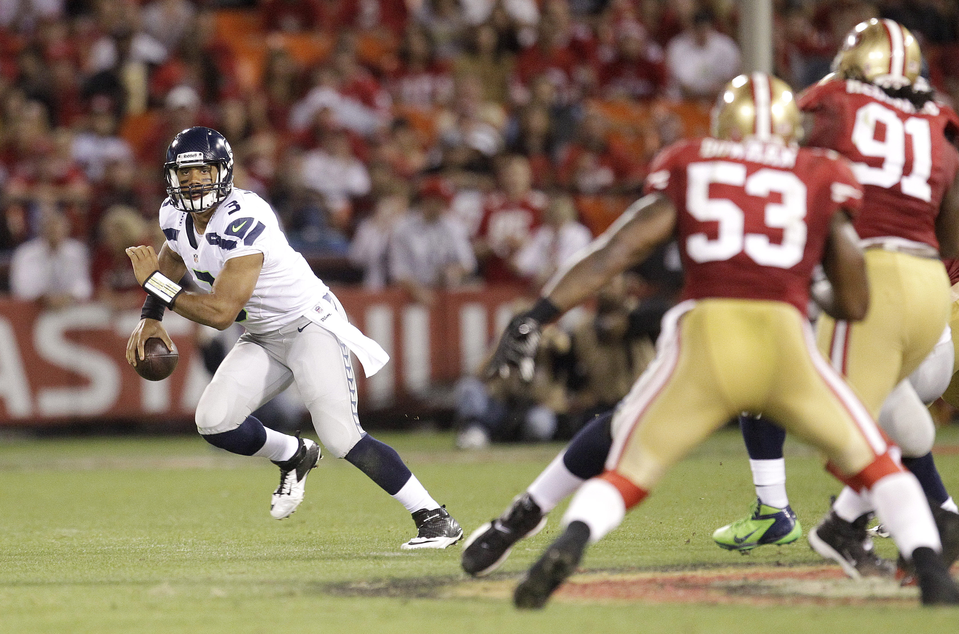 Seattle quarterback Russell Wilson (3) scrambles against the 49ers during the Seahawks' 13-6 loss to San Francisco. The Associated Press