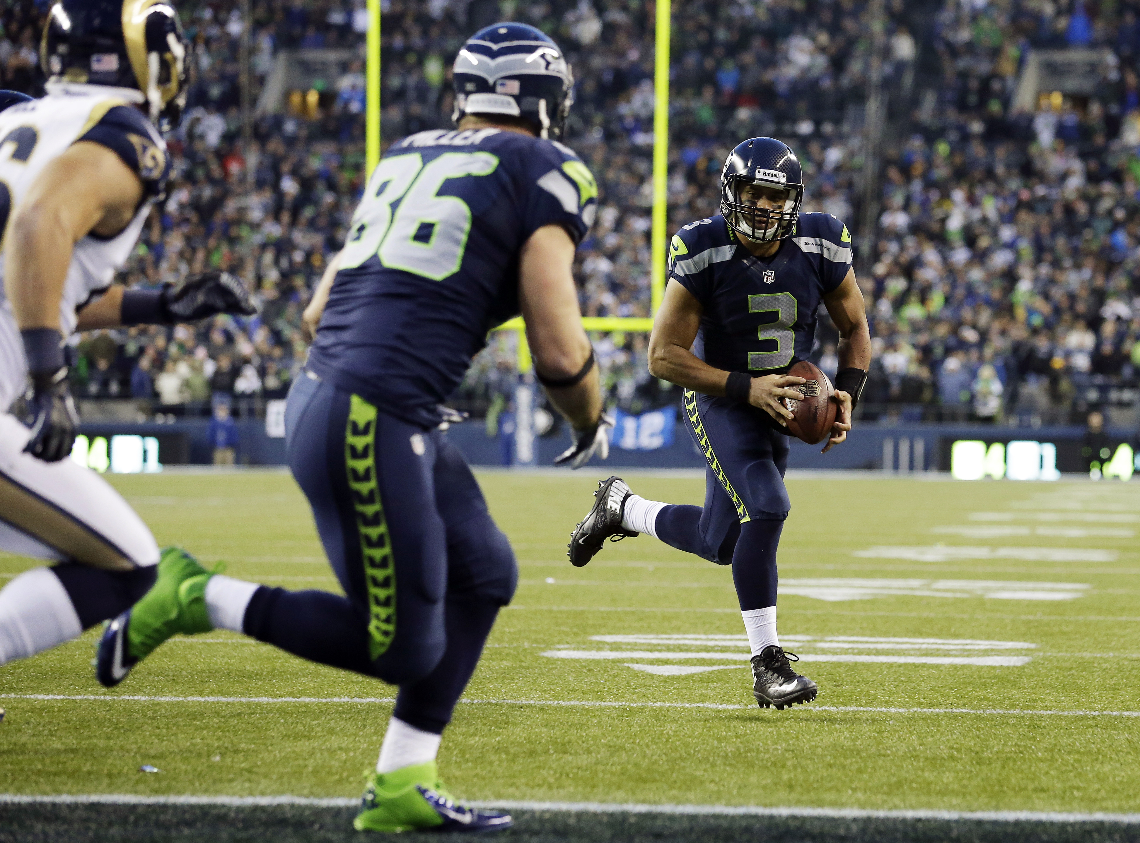 Seattle Seahawks quarterback Russell Wilson (3) runs for the winning touchdown against the St. Louis Rams on Sunday. The Associated Press