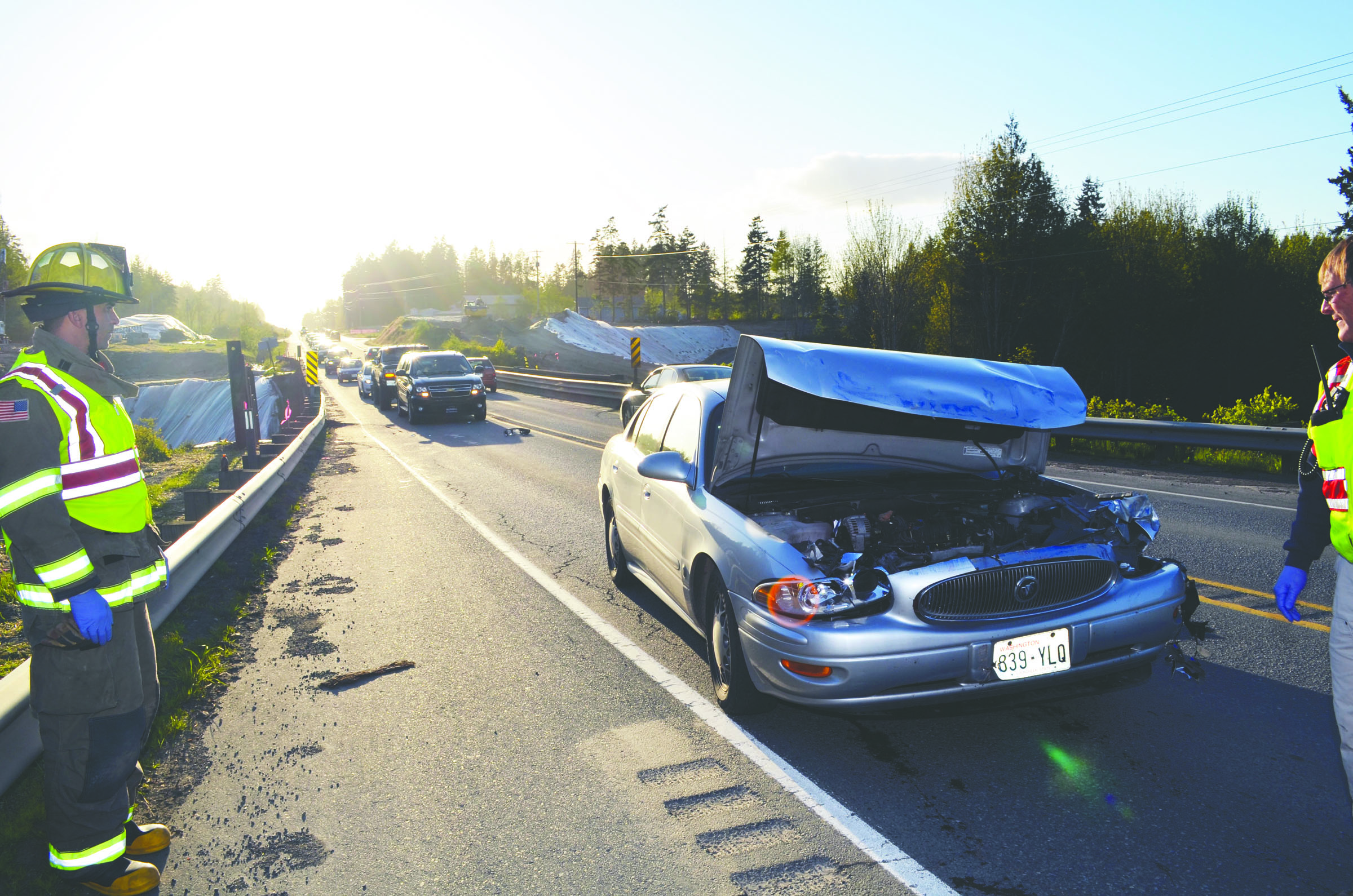 Clallam County Fire District No. 3 crews respond Monday to a two-car wreck on U.S. Highway 101 west of Sequim. Clallam County Fire District No. 3