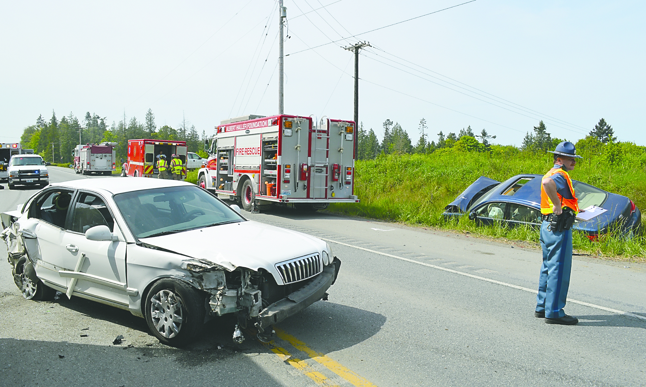 An injury involving two cars and a semi blocked Highway 101 for more than an hour at the Barr Road intersection Friday afternoon. WSP Trooper Rick Ward said there were no serious injuries from the wreck. Joe Smillie/Peninsula Daily News