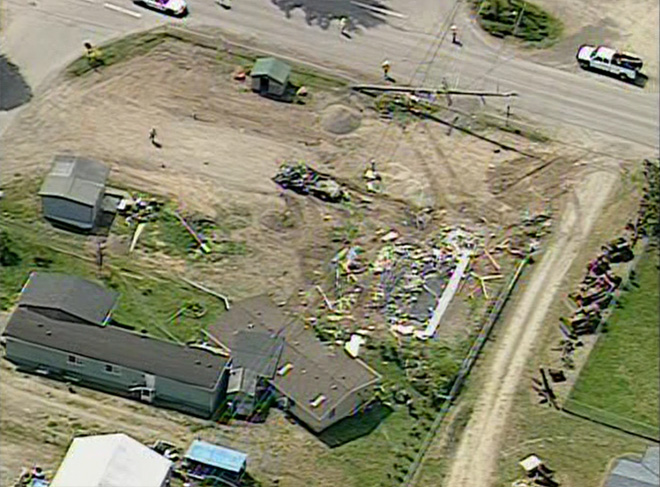 A house pushed off its foundation into another home in the Gales Addition housing area east of Port Angeles today is pictured in this aerial photo. A man has been arrested. KOMO-TV