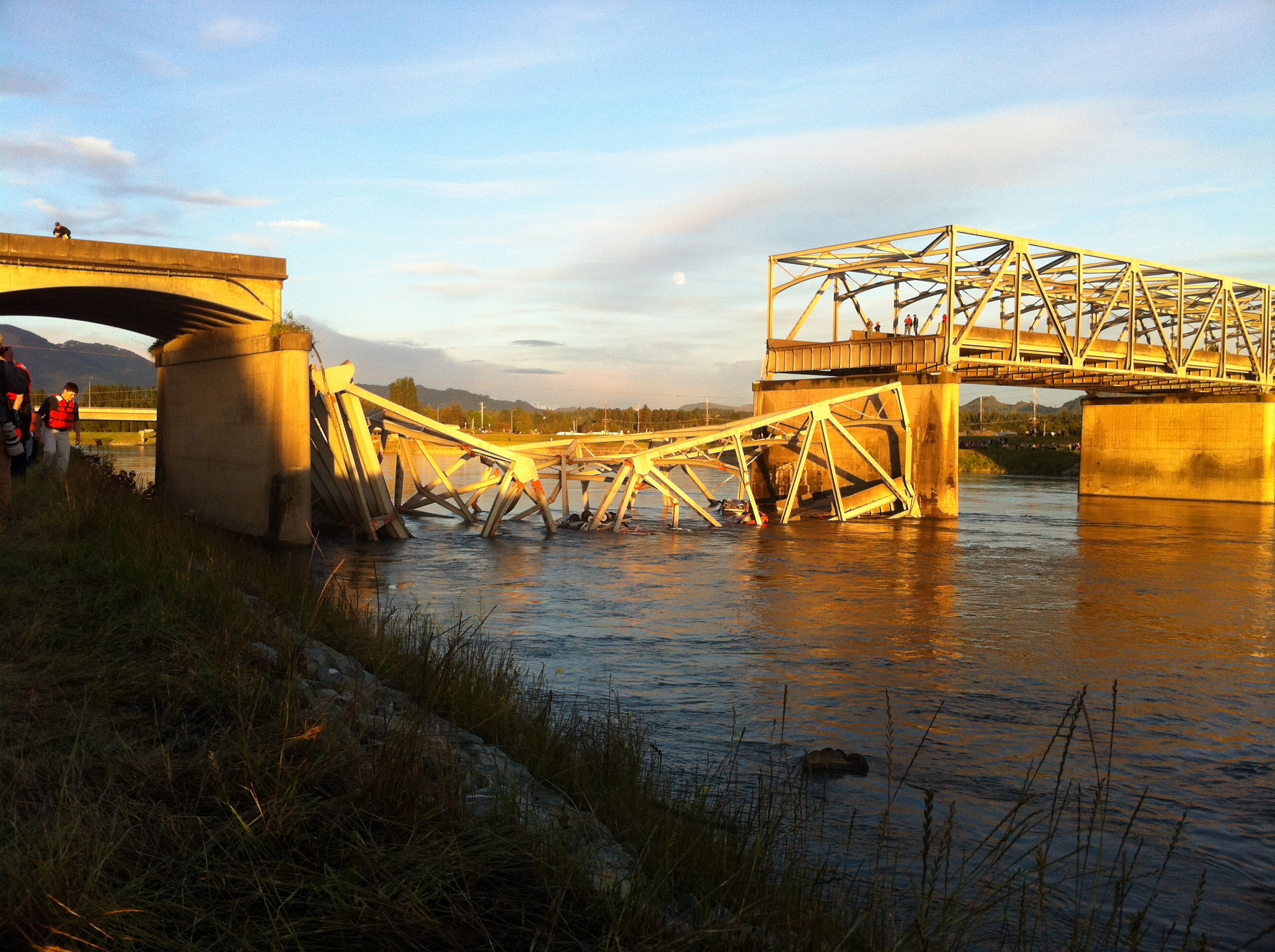 A portion of the Interstate 5 bridge is submerged after it collapsed into the Skagit River.