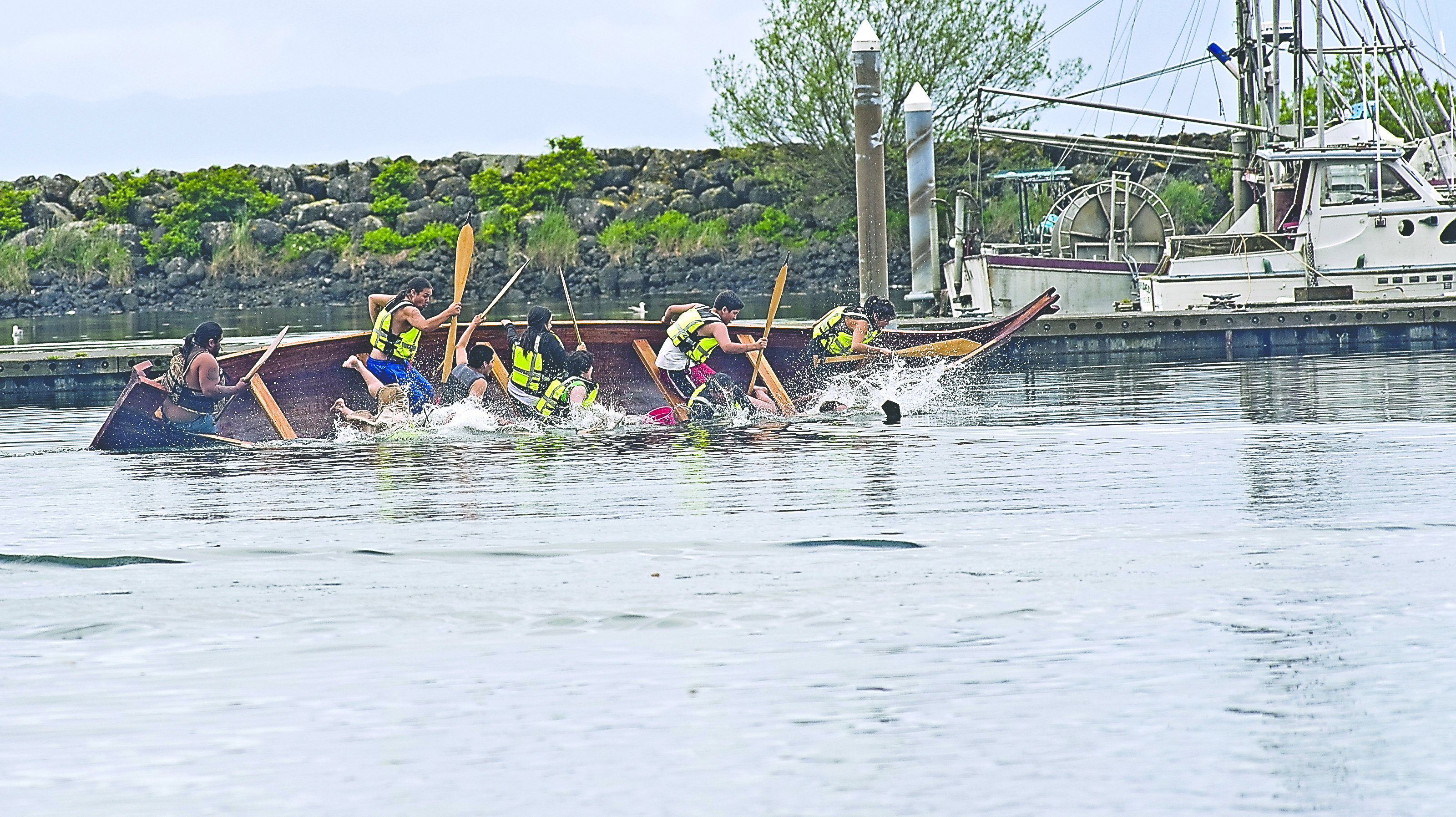 Canoe Journey participants practice tipping over their canoes in the Makah Marina in Neah Bay during a training session hosted by the Makah and Hoh tribes. Debbie Ross-Preston