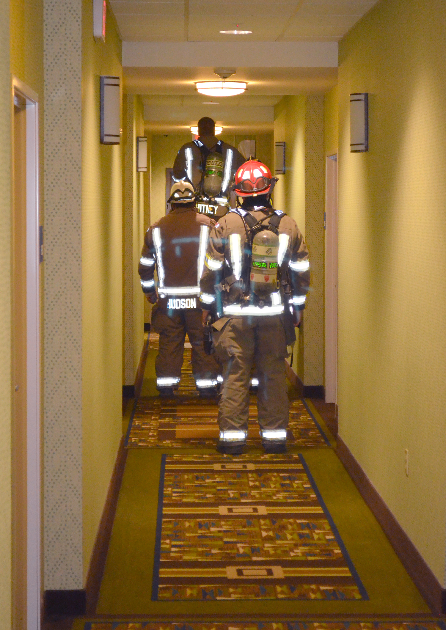 A team of firefighters seek the source of an odor and haze in a hallway of the Holiday Inn Express in Sequim. The source was never found. Clallam County Fire District No. 3