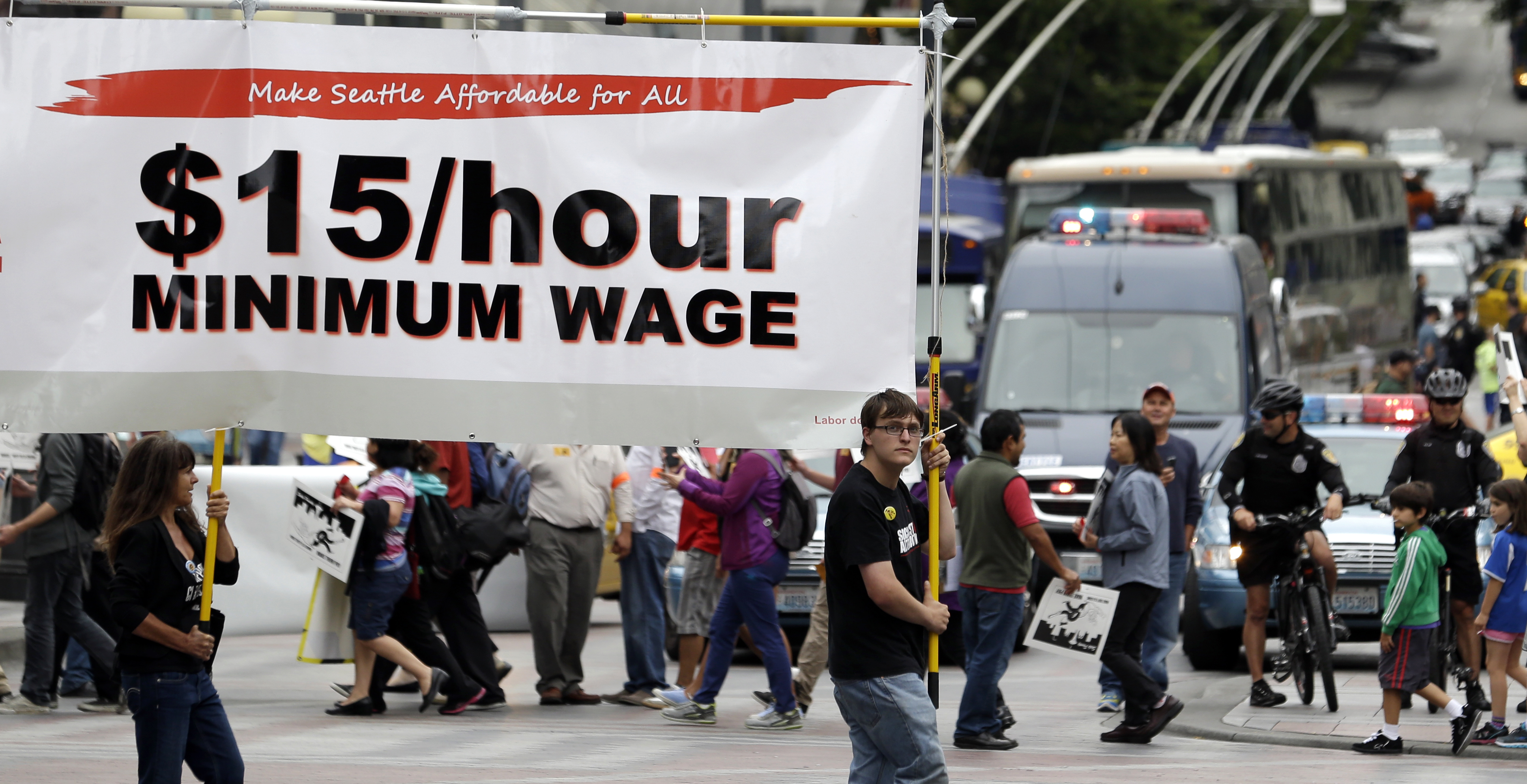 Demonstrators protesting wages and treatment for fast-food workers march in downtown Seattle on Aug. 1. The Associated Press