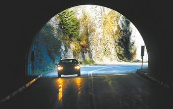 A car makes its way through the third of three tunnels on the way up Hurricane Ridge Road in Olympic National Park. Keith Thorpe/Peninsula Daily News
