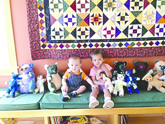 Griffin and Momoka Bartsch were the first to pick out a teddy bear from a box donated to First Step Family Support Center by inmates at Clallam Bay Corrections Center who made the toys through the Bears From Behind Bars Program.