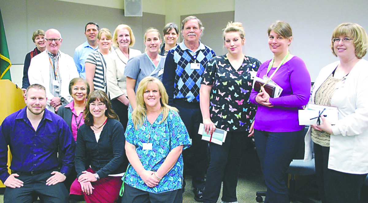 BUSINESS — 12 honored by OMC for work on new Epic healthrecords system