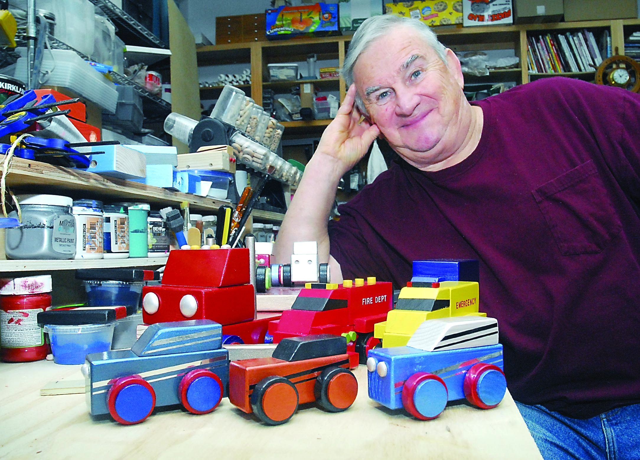 Larry Laing of Sequim is seen with some of the wooden toy cars and trucks he constructs in his home workshop and then donates to needy youngsters