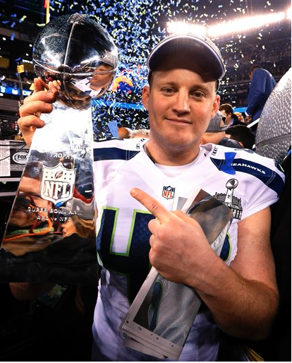 Seattle Seahawks' Clint Gresham holds the Lombardi Trophy. The Associated Press