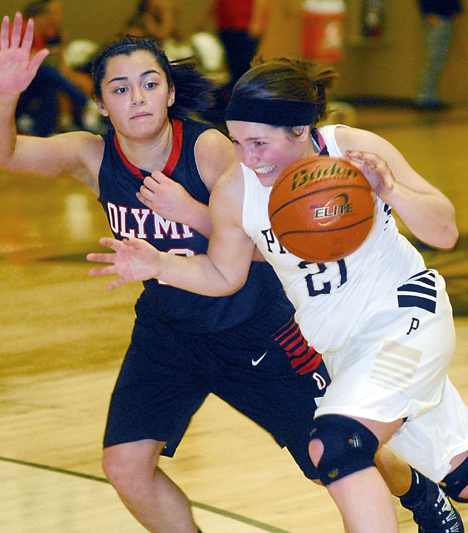 Peninsula's Alison Knowles drives past Olympic's Amanda Carper in the second half of the Pirates' 64-58 win. Knowles finished with a game-high 15 points. Keith Thorpe/Peninsula Daily News
