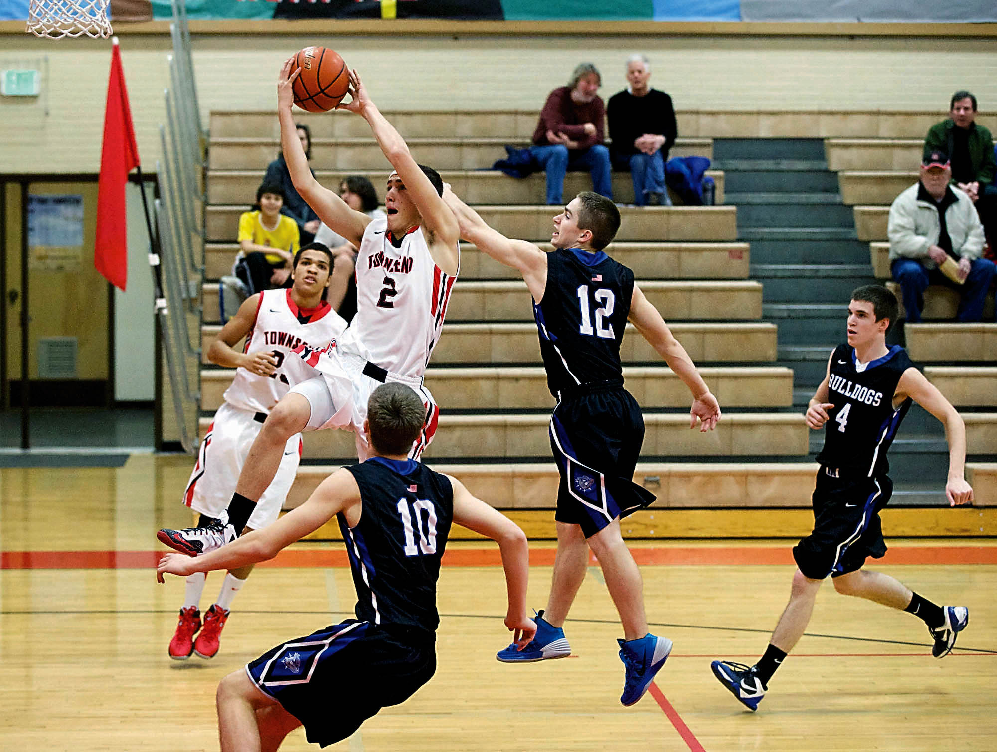 Port Townsend's Cody Russell (2) goes to the hoop during the Redskins' Olympic League win. Steve Mullensky/for Peninsula Daily News