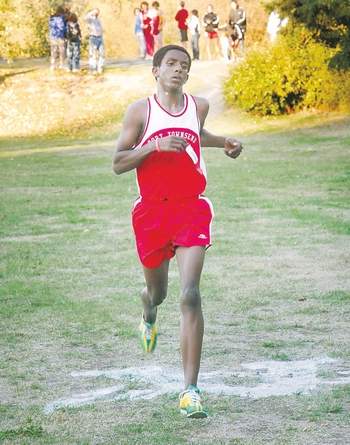 Bereket Piatt crosses the finish line of a North Olympic Peninsula cross-country meet for Port Townsend High School in 2009. Keith Thorpe/Copyright &Copy; 2013