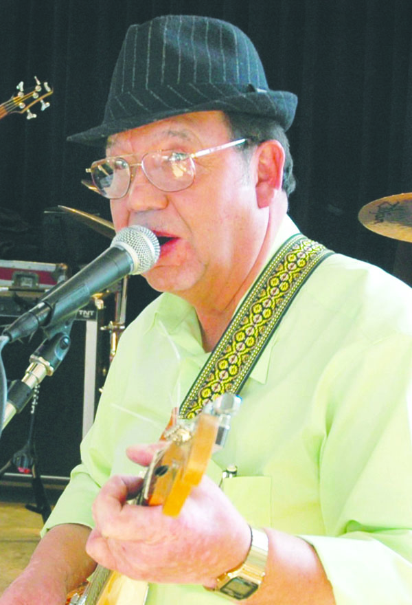Philip Adams is shown performing at his retirement party in 2010. His pickup was found down an embankment of Lower Elwha Road on Saturday night. An autopsy was scheduled to be performed Monday. Peninsula College