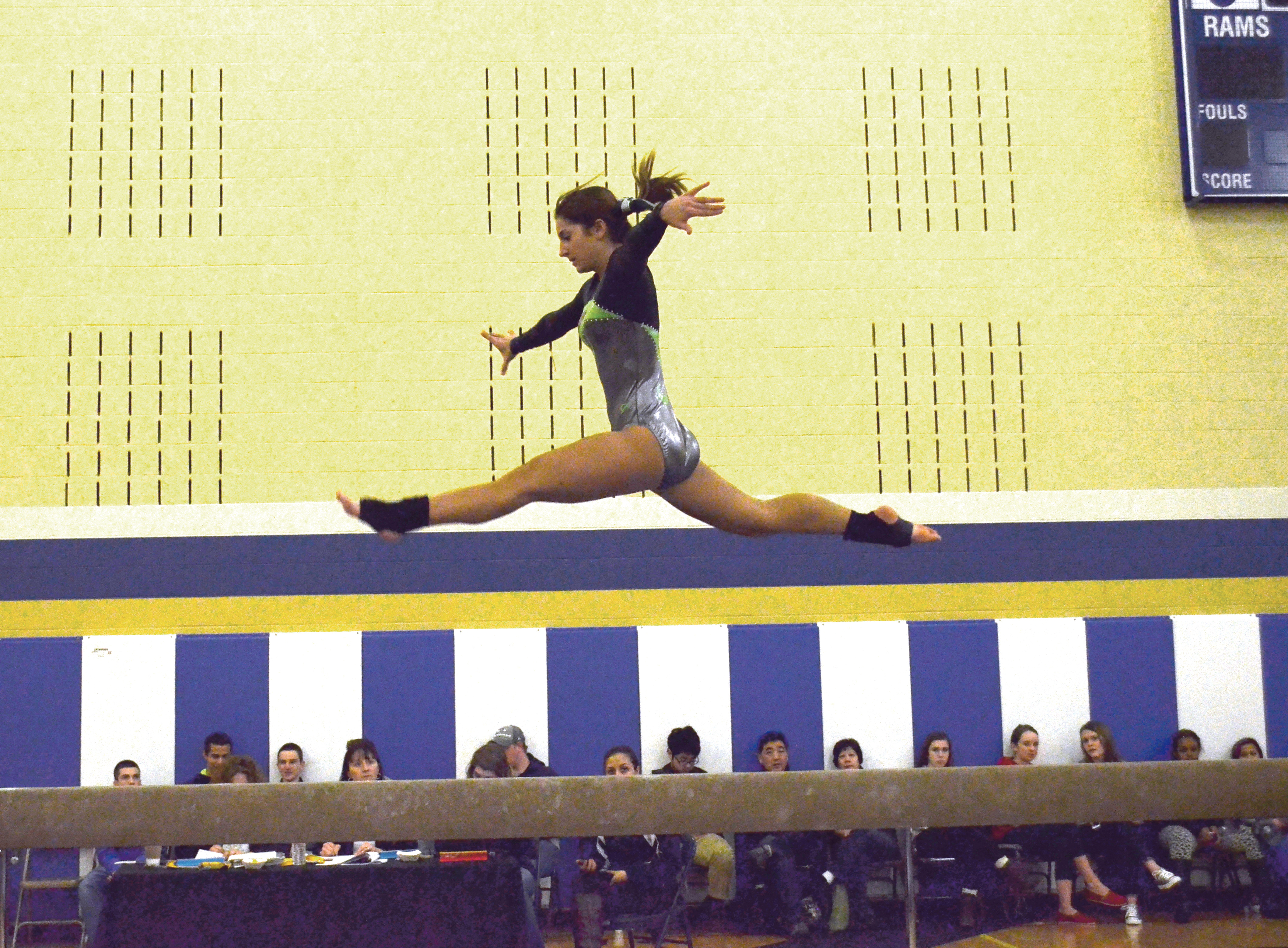 Port Angeles senior Katie Gibson performs on the balance beam at the district meet. Gibson qualified for state in beam and vault.