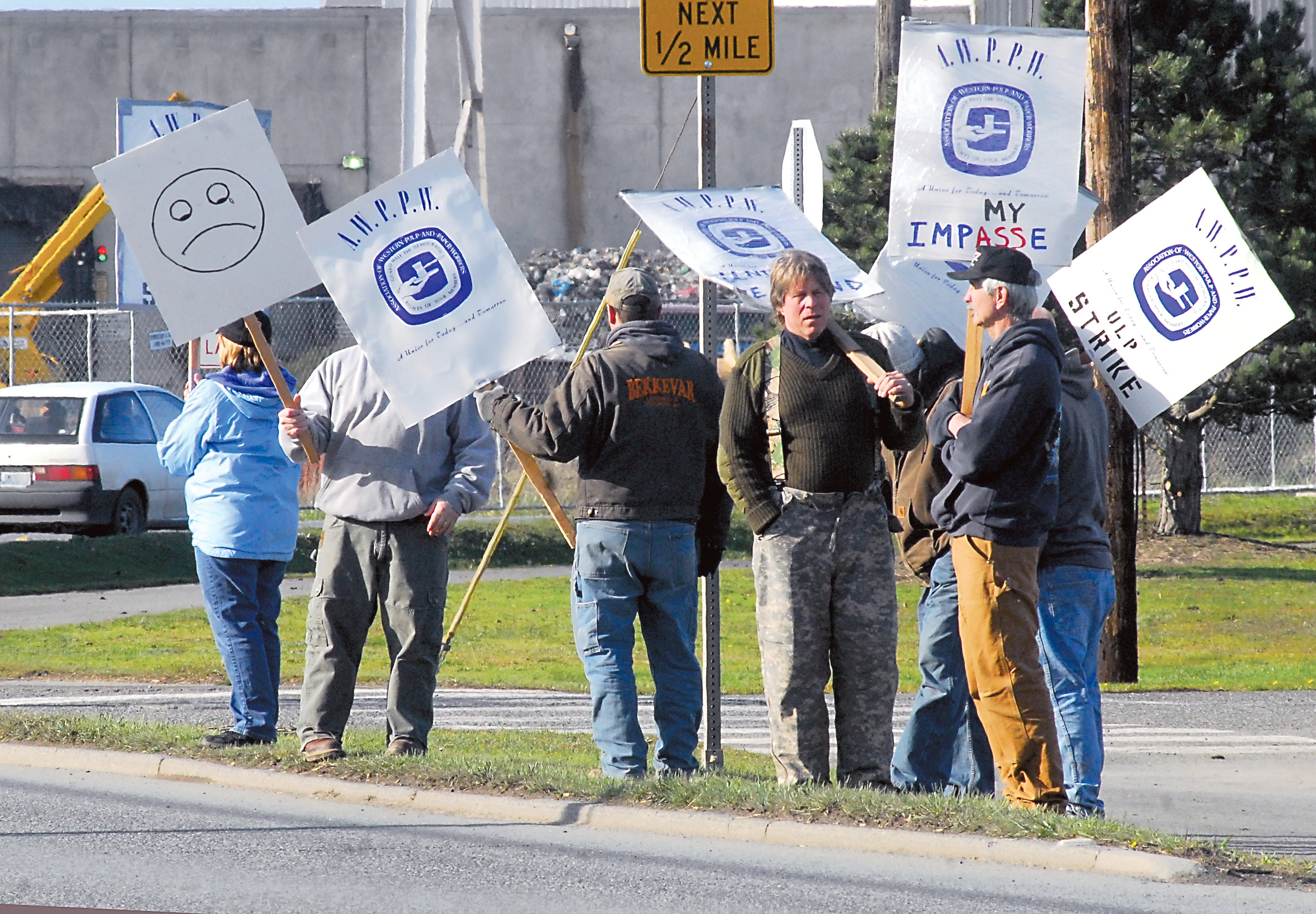 Pickets remain outside the Nippon Paper Industries USA mill in Port Angeles late this afternoon. They had not been told at that time of an apparent agreement to return to work Monday. Keith Thorpe/Peninsula Daily News