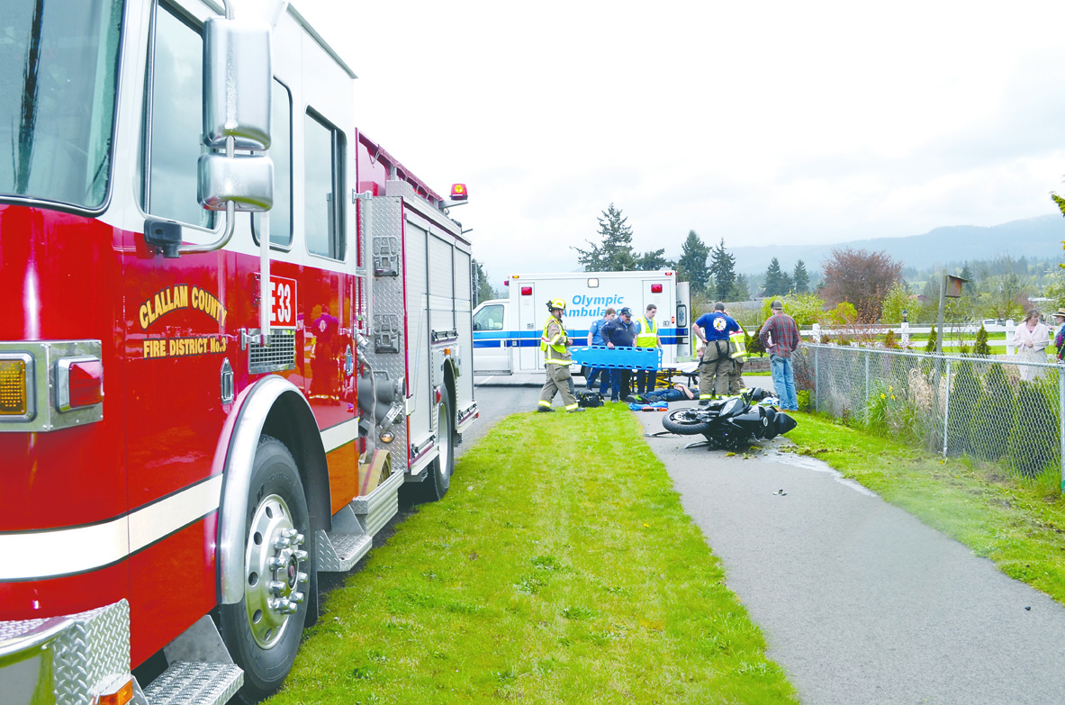 Clallam County Fire District No. 3 responds to a collision between a motorcycle and a pickup truck on Mill Road just south of East Runnion Road in Carlsborg. Clallam County Fire District No. 3