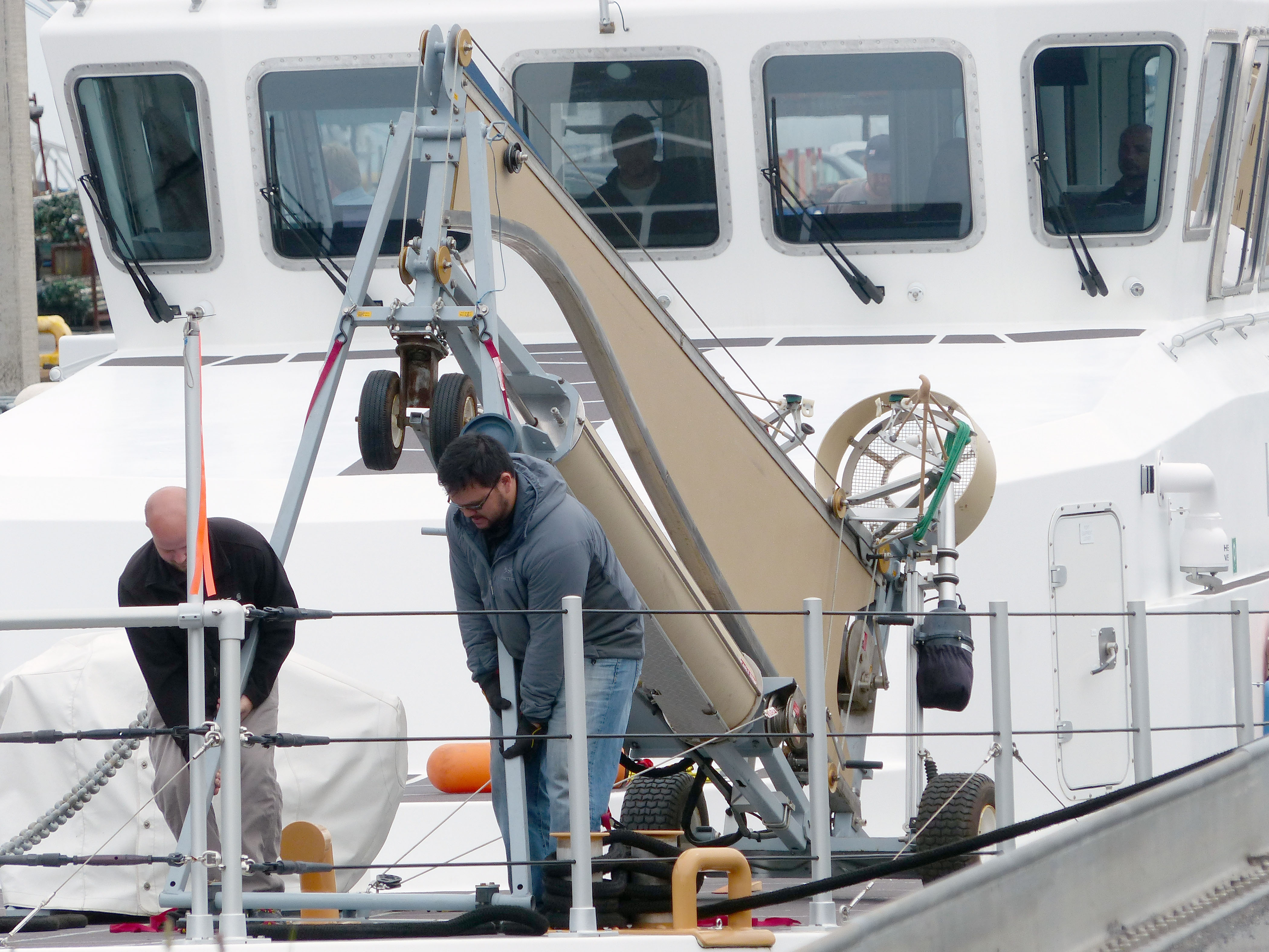 Contract workers install an unmanned-aircraft system aboard Westport Shipyards Solution at Port Angeles Boat Haven. Photo by David G. Sellars/for Peninsula Daily News
