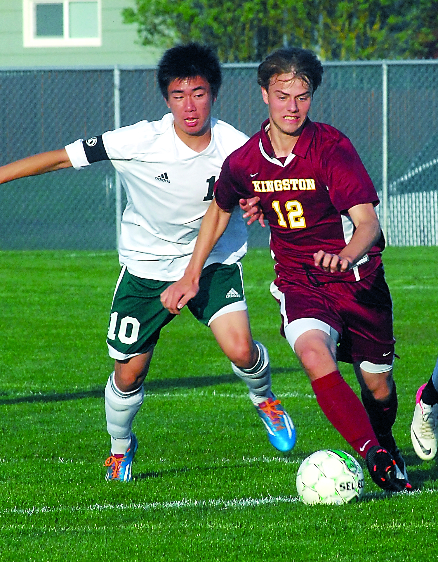 Port Angeles' Wei-Yan Fu fights for possession with Kingston's Jacob Waterman during the first half of the Roughriders' 3-0 loss at Civic Field. Keith Thorpe/for Peninsula Daily News