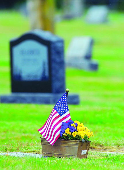 An American flag marks a grave at Ocean View Cemetery in Port Angeles in 2012. Keith Thorpe/Peninsula Daily News