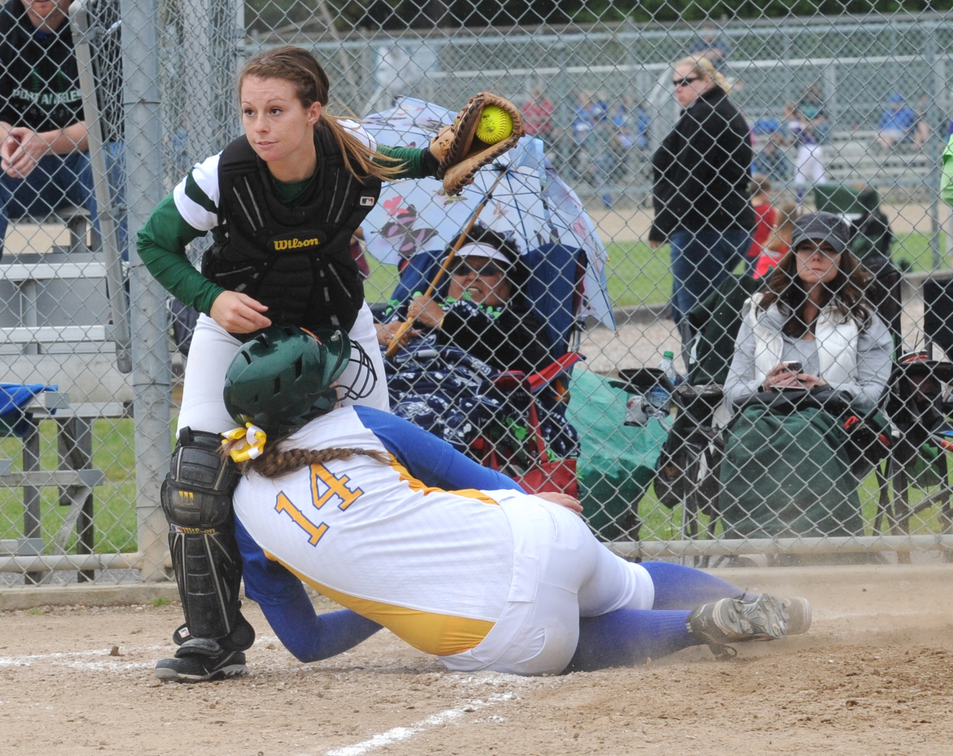 Port Angeles catcher Tori Kuch looks towards the bases for advancing runners after Fife's Breanna Richardson was called out at the plate. Lonnie Archibald/for Peninsula Daily News