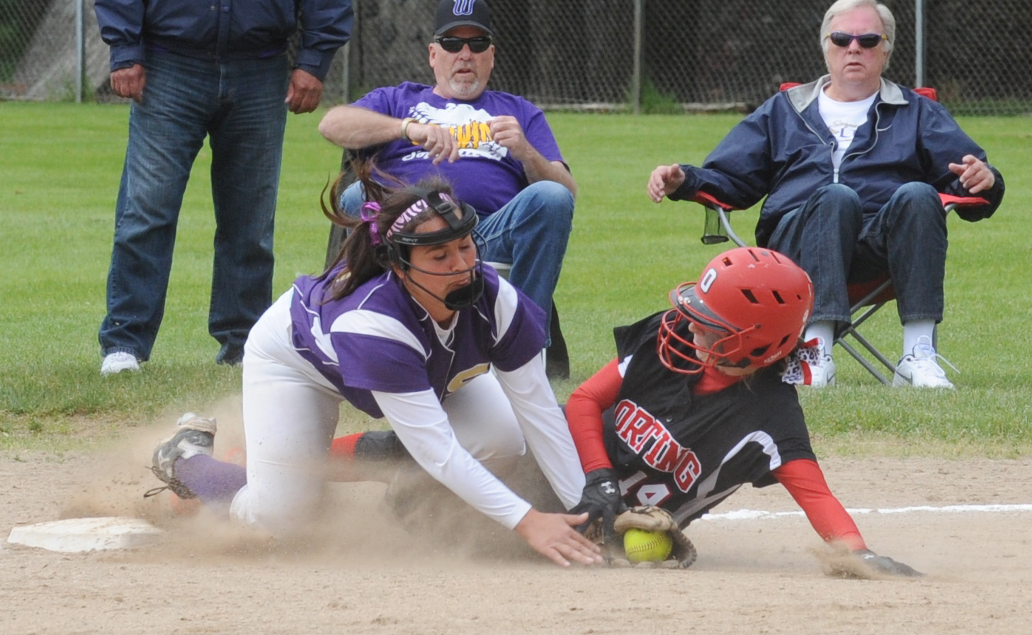Sequim third baseman Olivia Kirsch tags Orting's Tatum Trip out at third in the Wolves' 3-1 victory in the West Central District semifinals at Sprinker Fields. Lonnie Archibald/for Peninsula Daily News