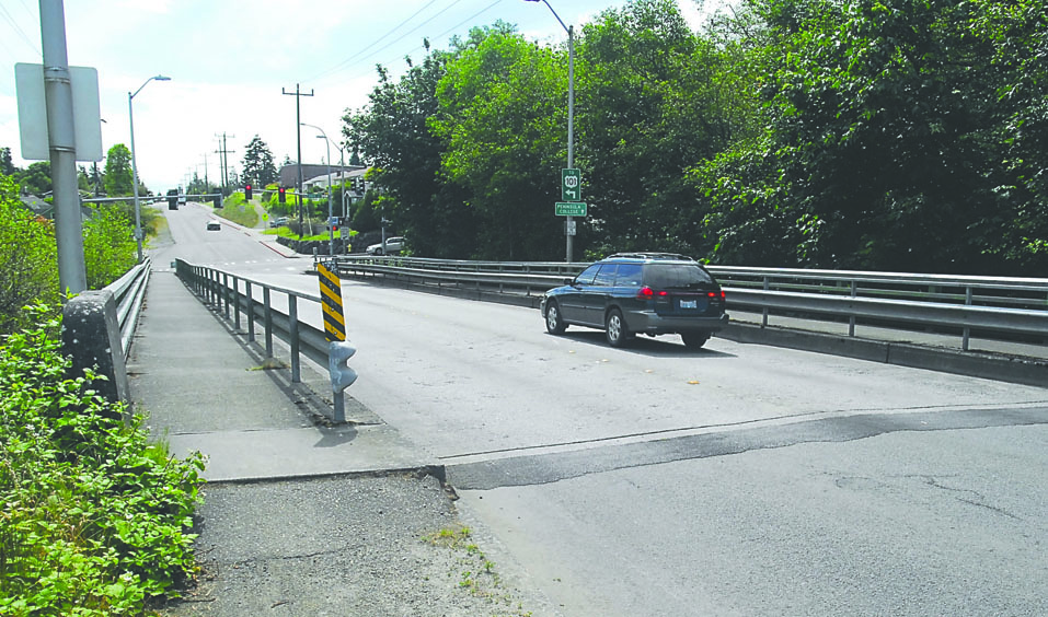 A car crosses the Lauridsen Boulevard bridge spanning Peabody Creek on Wednesday in Port Angeles. Keith Thorpe/Peninsula Daily News