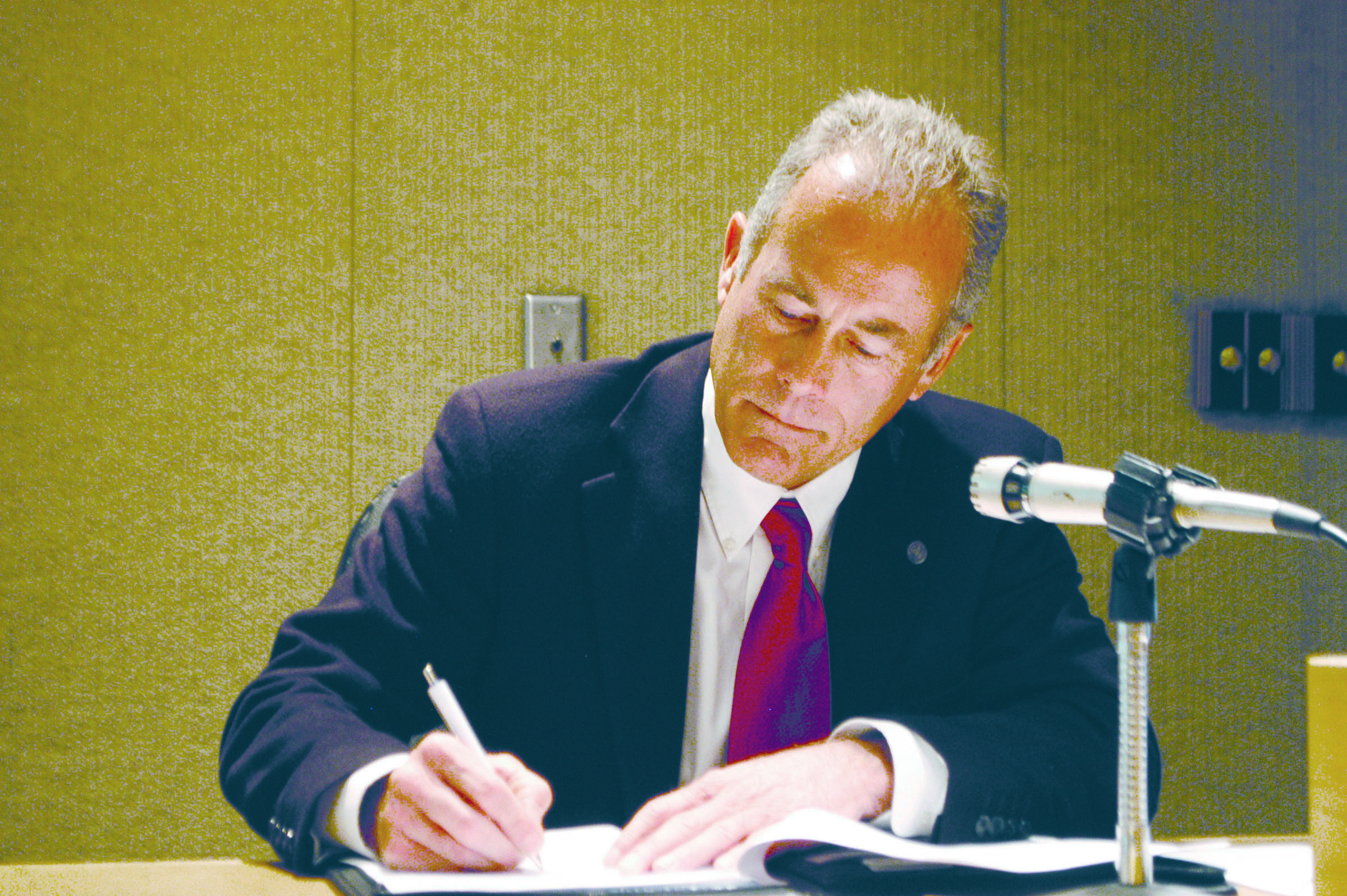 Jeff Robb signs a contract with the Port of Port Angeles on Monday