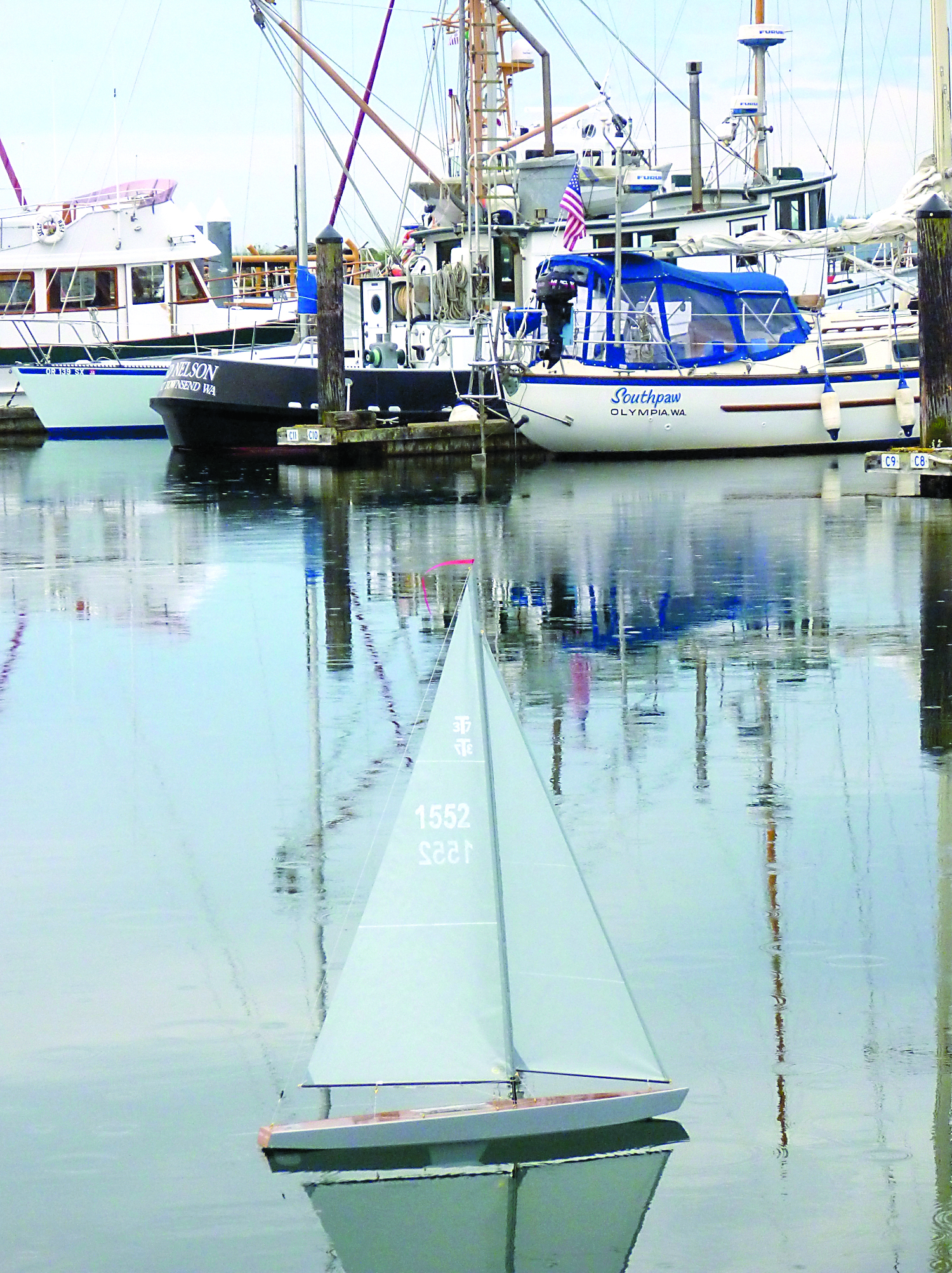 Gray Lady glides through the water on its inaugural sail in the Port Townsend Boat Haven marina. Each T37 kit is numbered by the maker. Gray Lady is No. 1552