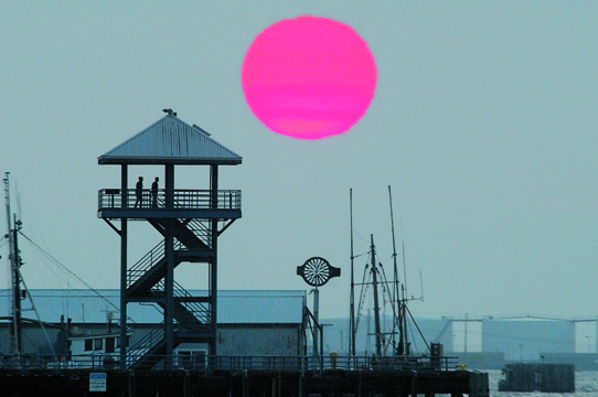 The sun sets behind Port Angeles City Pier Monday night. Keith Thorpe/Peninsula Daily News